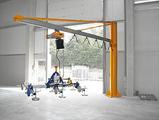 Crane and rail system with connected vacuum lifter