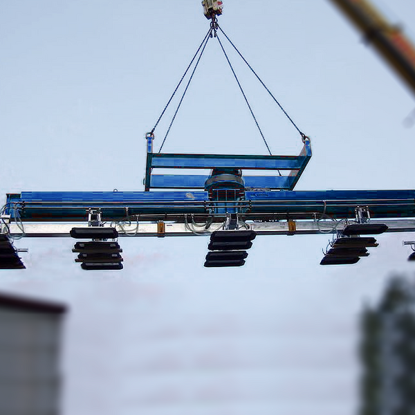 Heavy duty vacuum lifter is lifted into the air by crane