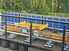 Heavy duty vacuum lifting equipment is delivered to the construction site by truck