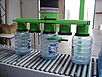 Tube lifter of the company AERO-LIFT lifts bottles in the food industry