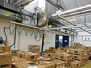 Crane and rail systems for lifting cartons with the help of a vacuum lifting device attached to the ceiling