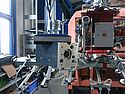 Tube lifter with VUSS Flexlift lifts aluminum block in a production hall