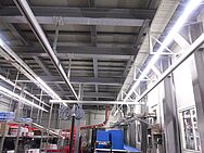 Crane and rail system in a production facility