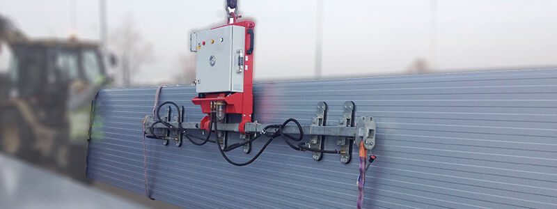 Construction site device vacuum lifter CLAD-BOY when lifting wall panels on the construction site.