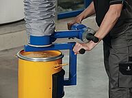 Woman with side barrel tube lifter Suction foot lifts barrel with tube lifter