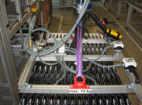 Vacuum lifter transports solar tubes in a production hall