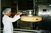 AERO-LIFT tube lifter lifts a cheese wheel in the food industry